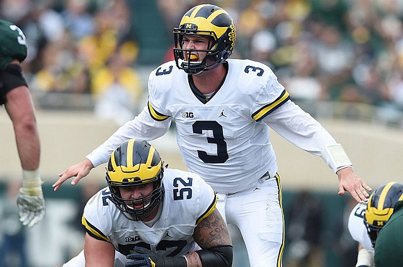 Mason Cole (52) and Wilton Speight (3)