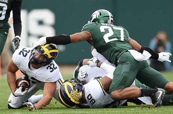 Ty Isaac (32) and Khalid Hill (80)