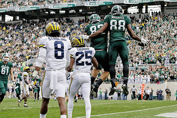 Channing Stribling (8) and Dymonte Thomas (25)