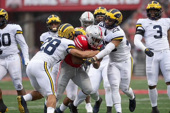 Brandon Watson (28), Tyree Kinnel (23), and Rashan Gary (3)