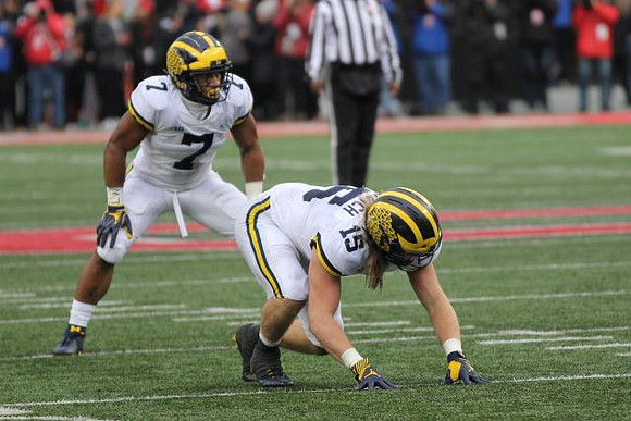 Khaleke Hudson (7) and Chase Winovich (15)