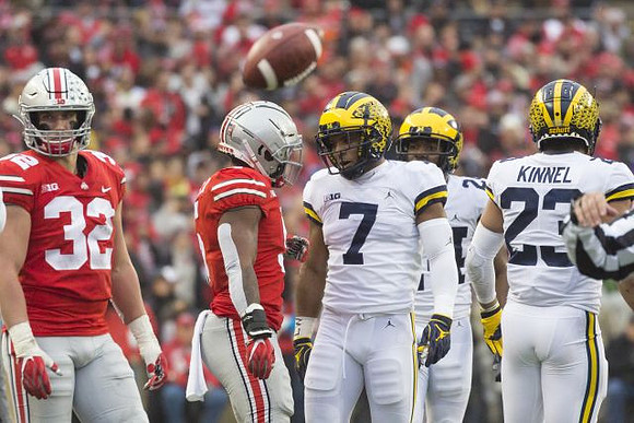 Khaleke Hudson (7), Lavert Hill (24), and Tyree Kinnel (23)