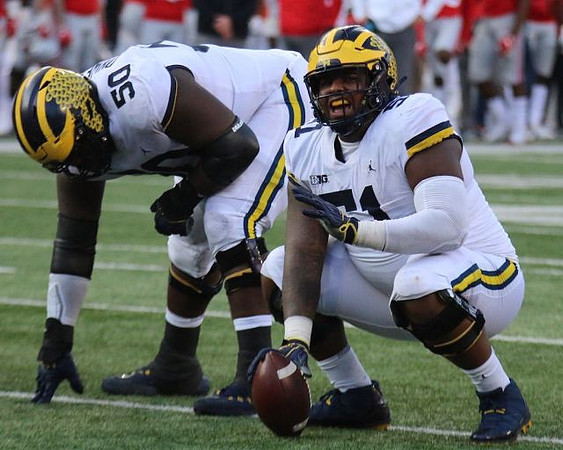 Michael Onwenu (50) and Cesar Ruiz (51)
