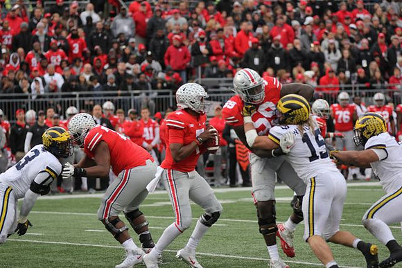 Rashan Gary (3) and Chase Winovich (15)