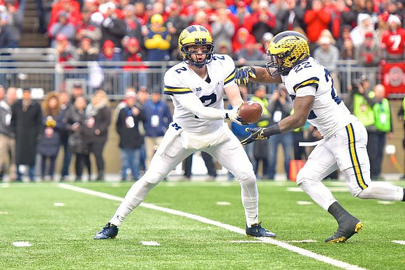 Shea Patterson (2) and Karan Higdon (22)