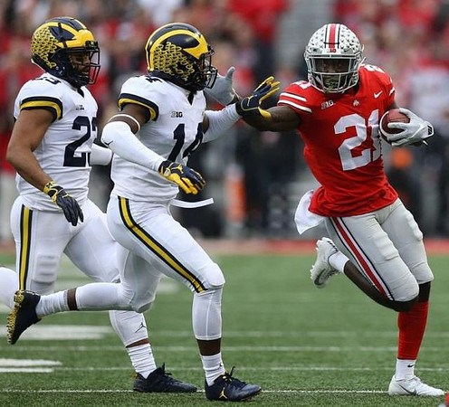 Tyree Kinnel (23) and Josh Metellus (14)