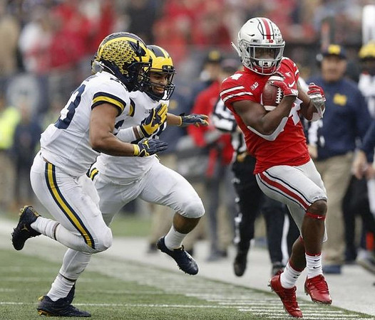 Tyree Kinnel (23) and Brandon Watson (28)