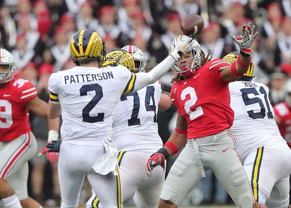 Shea Patterson (2), Ben Bredeson (74), and Cesar Ruiz (51)