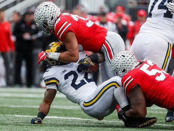Karan Higdon (22) and Ben Bredeson (74)
