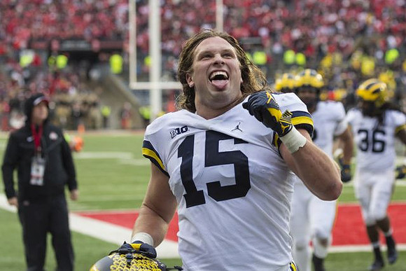 Chase Winovich (15) and Devin Gil (36)