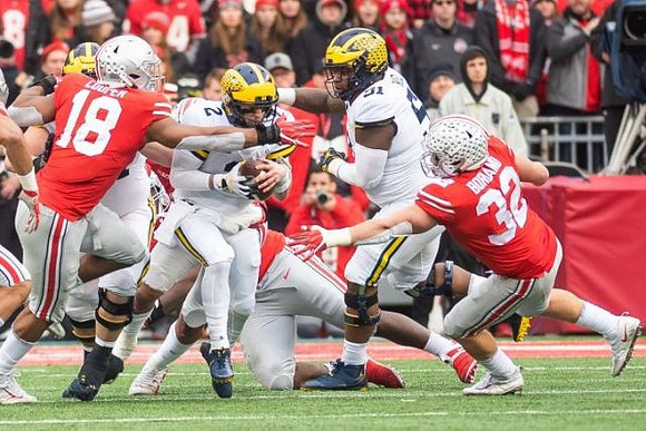 Shea Patterson (2) and Cesar Ruiz (51)