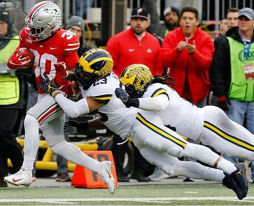 Tyree Kinnel (23) and Devin Bush (10)