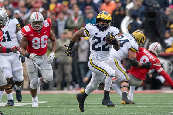 Cesar Ruiz (51), Karan Higdon (22), and Ben Bredeson (74)