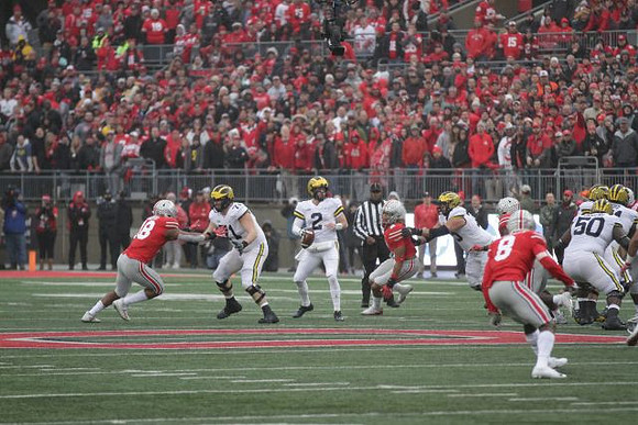 Andrew Stueber (71), Shea Patterson (2), Jon Runyan Jr. (75), and Michael Onwenu (50)