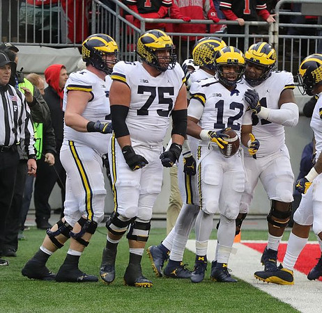 Andrew Stueber (71), Jon Runyan Jr. (75), Chris Evans (12), and Cesar Ruiz (51)