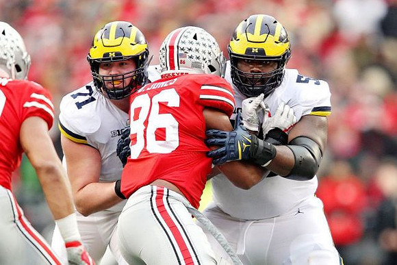 Andrew Stueber (71) and Michael Onwenu (50)