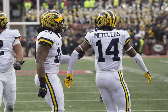 Devin Bush (10) and Josh Metellus (14)