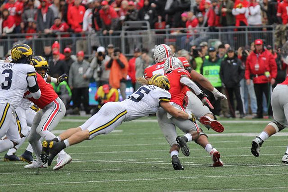 Rashan Gary (3) and Chase Winovich (15)