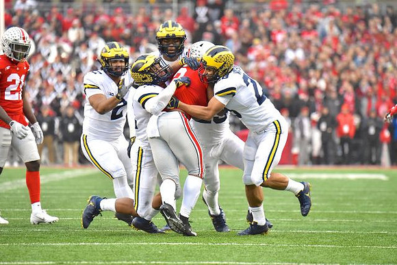 Carlo Kemp (2), Rashan Gary (3), and Brandon Watson (28)
