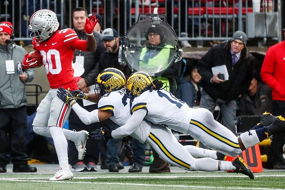 Tyree Kinnel (23) and Devin Bush (10)
