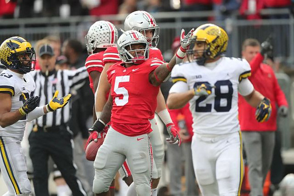 Tyree Kinnel (23) and Brandon Watson (28)