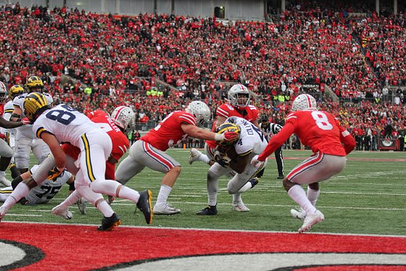 Ben Bredeson (74), Jon Runyan Jr. (75), Sean McKeon (84), and Nico Collins (4)
