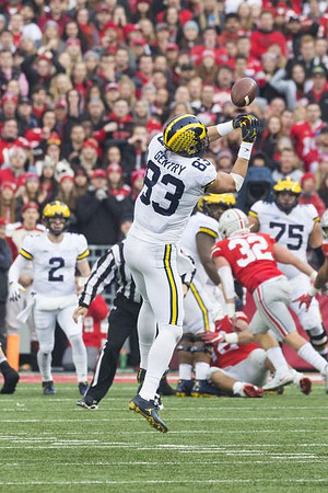 Shea Patterson (2), Zach Gentry (83), and Jon Runyan Jr. (75)