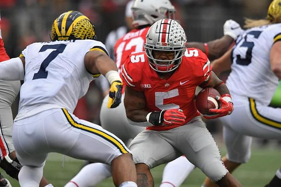 Khaleke Hudson (7) and Chase Winovich (15)