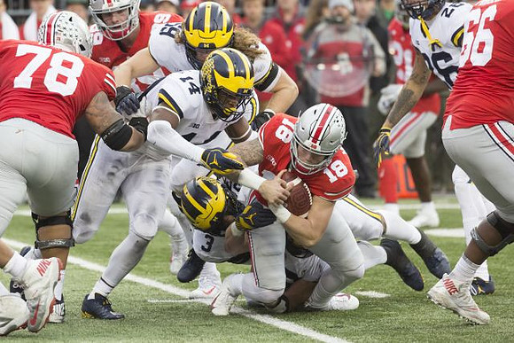 Noah Furbush (59), Josh Metellus (14), Rashan Gary (3), and J'Marick Woods (26)