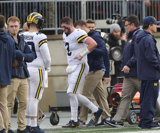 Shea Patterson (2) and Andrew Robinson (49)