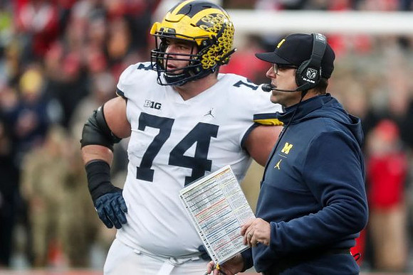 Ben Bredeson (74) and Jim Harbaugh