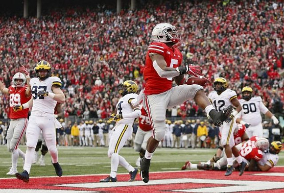 Aidan Hutchinson (97), Josh Metellus (14), Josh Ross (12), and Bryan Mone (90)
