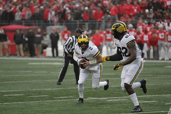 Shea Patterson (2) and Nick Eubanks (82)