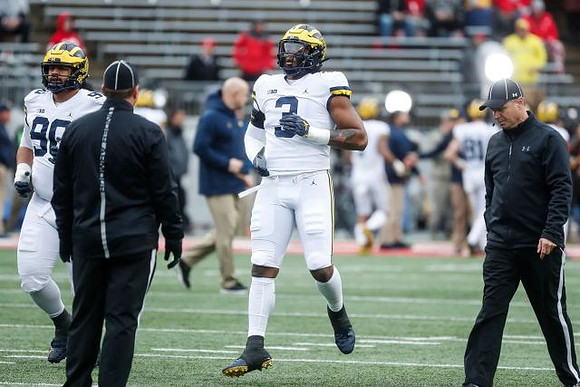 Bryan Mone (90) and Rashan Gary (3)