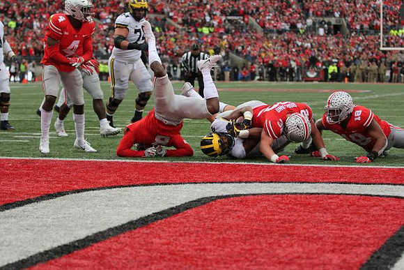 Ben Bredeson (74) and Nico Collins (4)