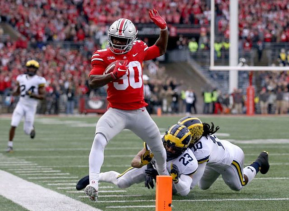 Tyree Kinnel (23), Devin Bush (10), and Lavert Hill (24)