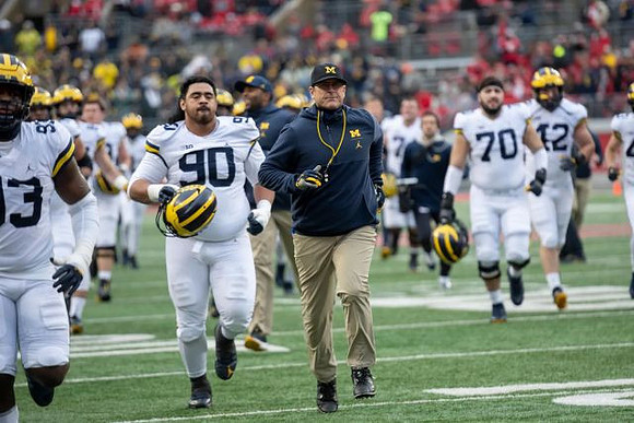Lawrence Marshall (93), Bryan Mone (90), Jim Harbaugh, Nolan Ulizio (70), and Ben Mason (42)