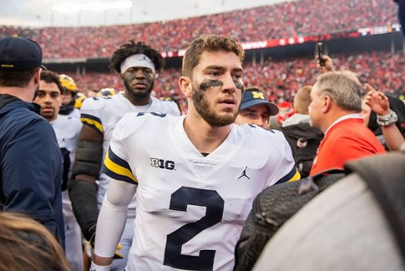 Shea Patterson (2) and Nick Eubanks (82)