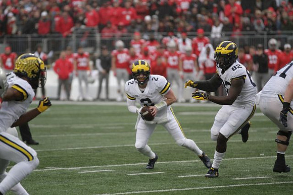 Shea Patterson (2), Nick Eubanks (82), and Andrew Stueber (71)