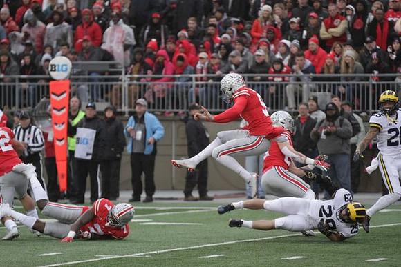 Jordan Glasgow (29) and J'Marick Woods (26)