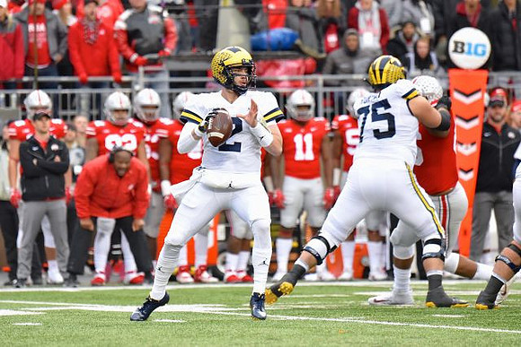 Shea Patterson (2) and Jon Runyan Jr. (75)