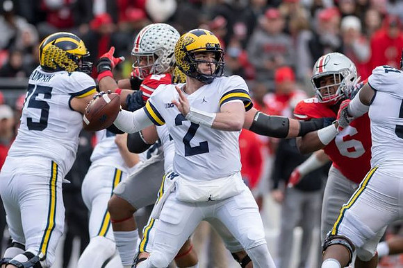 Jon Runyan Jr. (75), Shea Patterson (2), and Cesar Ruiz (51)