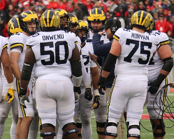 Michael Onwenu (50), Jim Harbaugh, and Jon Runyan Jr. (75)