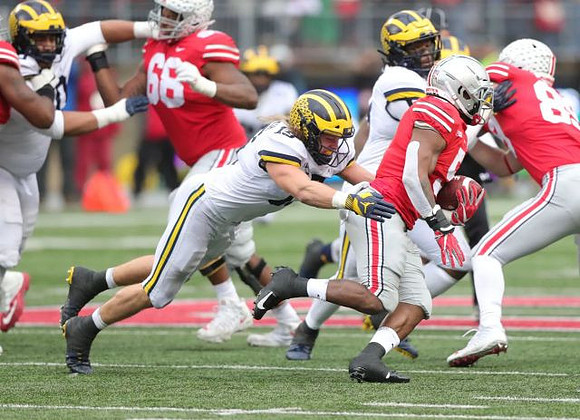 Bryan Mone (90), Chase Winovich (15), and Rashan Gary (3)