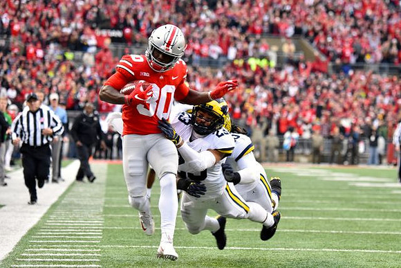 Tyree Kinnel (23) and Devin Bush (10)
