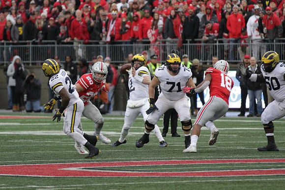 Karan Higdon (22), Shea Patterson (2), Andrew Stueber (71), and Michael Onwenu (50)
