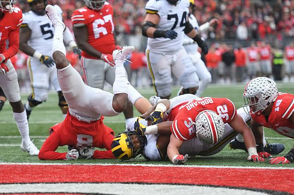 Cesar Ruiz (51), Ben Bredeson (74), and Karan Higdon (22)
