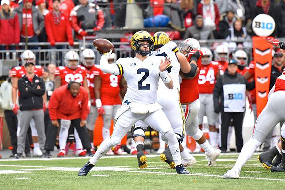 Shea Patterson (2) and Jon Runyan Jr. (75)