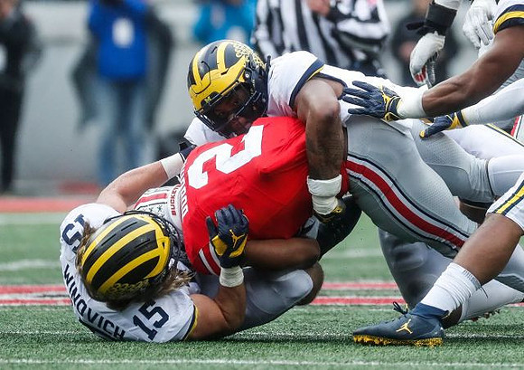 Chase Winovich (15) and Rashan Gary (3)