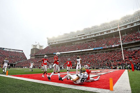 Nick Eubanks (82), Andrew Stueber (71), Zach Gentry (83), and Nico Collins (4)